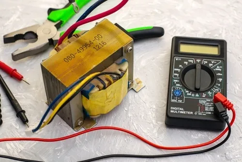 Electric,Transformer,Pliers,And,Ampervoltmeter,On,The,Table,Surface